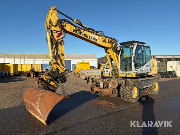 Hjulgraver New Holland 16/2012 skinnekørende med skovle